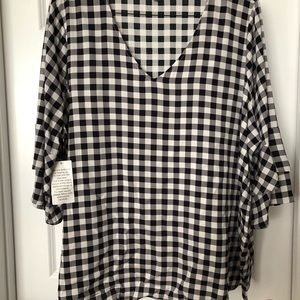 Black and white check top with tags